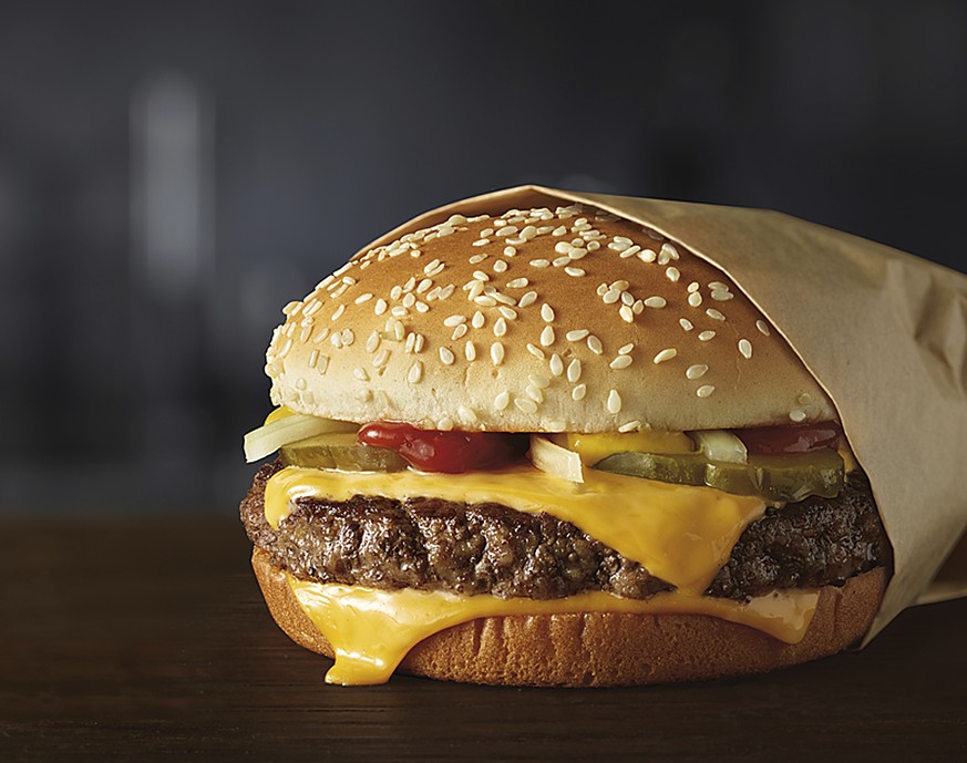 This image provided by McDonald’s Corporation shows a Quarter Pounder burger. McDonald&#039;s says it will swap frozen beef patties for fresh ones in its Quarter Pounder burgers by sometime in 2018 at ...