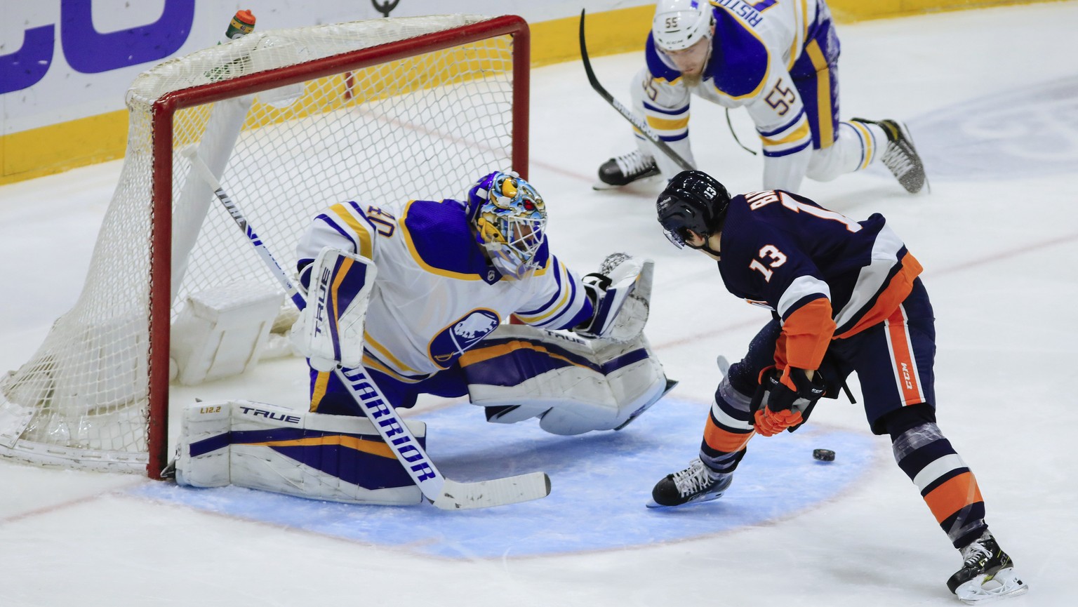 New York Islanders&#039; Mathew Barzal scores past Buffalo Sabres goaltender Carter Hutton in the second period of an NHL hockey game Saturday, March 6, 2021, in Uniondale, NY. (AP Photo/Kevin Hagen).