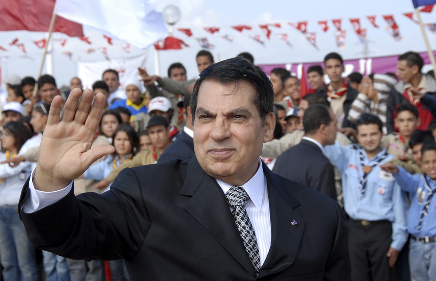 FILE - In this Nov.7, 2007 file photo, Tunisian President Zine EL Abidine Ben Ali waves to supporters in Rades, outside Tunis, before celebrations marking the 20th anniversary of Ben Ali&#039;s presid ...