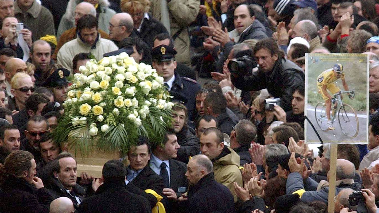 The coffin of Italian cycling legend and former Tour de France and Giro d&#039;Italia race winner Marco Pantani is carried outside the San Giacomo church in Cesenatico, northern Italy, Wednesday, Feb. ...