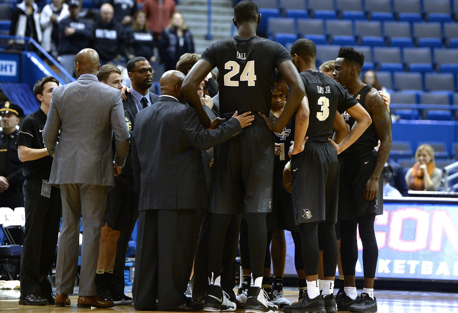 FILE - In this Jan. 8, 2017, file photo, Central Florida&#039;s Tacko Fall (24) stands above his team in a huddle during the first half of an NCAA college basketball game, in Hartford, Conn. The talle ...