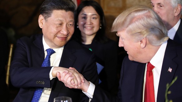 President Donald Trump, right, shakes hands with Chinese President Xi Jinping during a dinner at Mar-a-Lago, Thursday, April 6, 2017, in Palm Beach, Fla. (AP Photo/Alex Brandon)