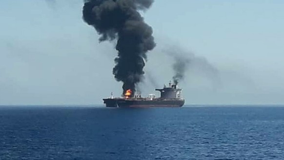 epa07645239 A handout photo made available by Iran&#039;s official state TV (IRIB) allegedly shows the crude oil tanker Front Altair on fire in the Gulf of Oman, 13 June 2019. According to the Norwegi ...