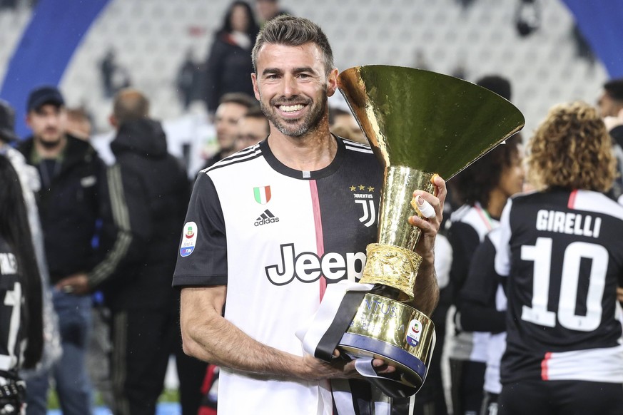 May 19, 2019 - Turin, Piedmont, Italy - Andrea Barzagli (Juventus FC) with the trophy of Scudetto during the victory ceremony following the Italian Serie A last football match of the season Juventus v ...