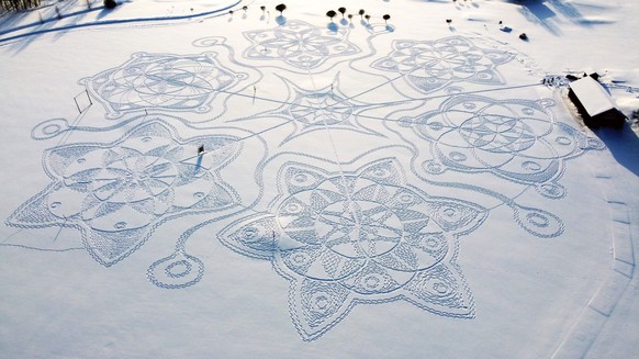 A giant complex geometric pattern formed from thousands of footsteps in the snow near to the capital Helsinki, in Espoo, Finland, Sunday Feb. 7, 2021. Under the guidance of an amateur artist Janne Pyy ...