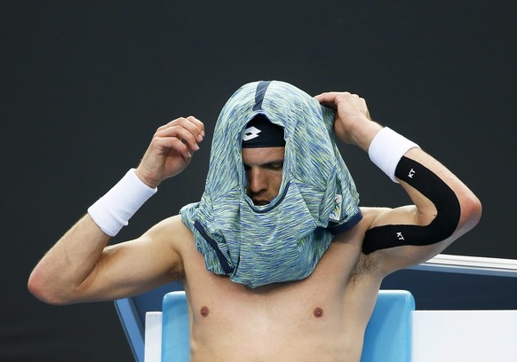 epa05724146 Jiri Vesely of the Czech Republic changes his shirt during a break of his men&#039;s Singles first round match against Gael Monfils of France at the Australian Open Grand Slam tennis tourn ...