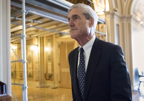 FILE - In this June 21, 2017, file photo, special counsel Robert Mueller departs after a meeting on Capitol Hill in Washington. America has waited a year to hear what Mueller concludes about the 2016  ...