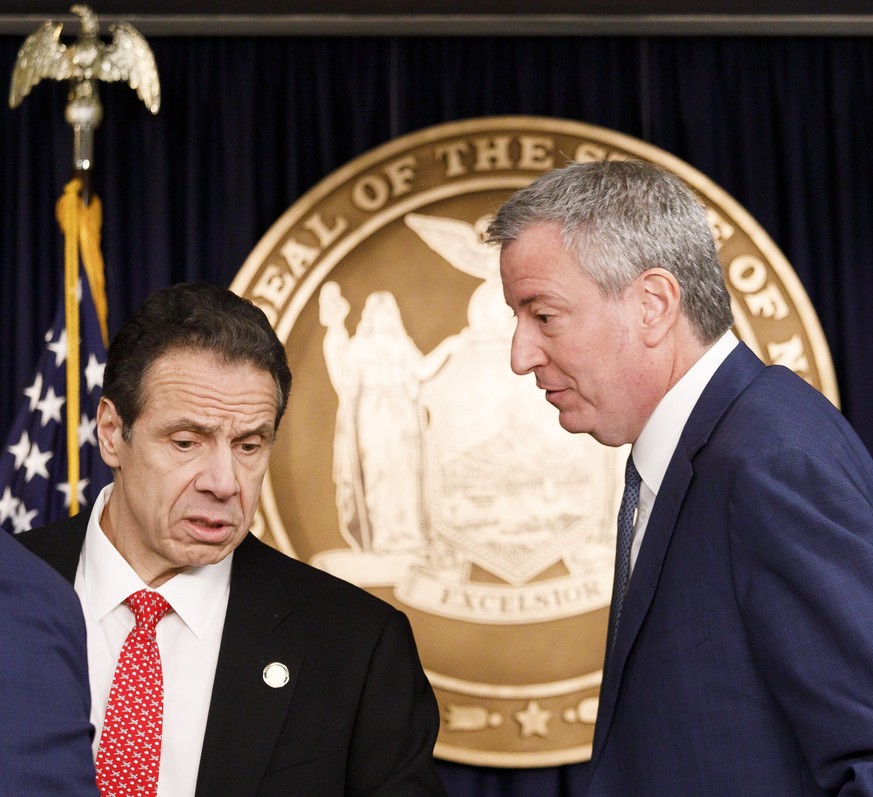 epa08265006 New York Governor Andrew Cuomo (L) and New York City Mayor Bill de Blasio (R) speak during a press conference about the city?s first known case of the coronavirus in New York, New York, US ...