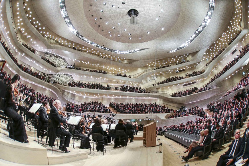 German President Joachim Gauck and Chancellor Angela Merkel, attend the opening concert and ceremony at the &quot;Elbphilharmonie&quot; (Philharmonic Hall) along the Elbe river in Hamburg, Germany, Ja ...