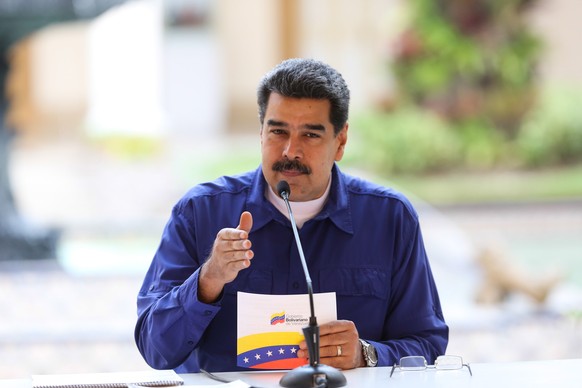 epa07497971 A handout photo made available by Miraflores Press, shows the Venezuelan President Nicolas Maduro speaking during an event in Caracas, Venezuela, 10 April 2019. Maduro announced an agreeme ...