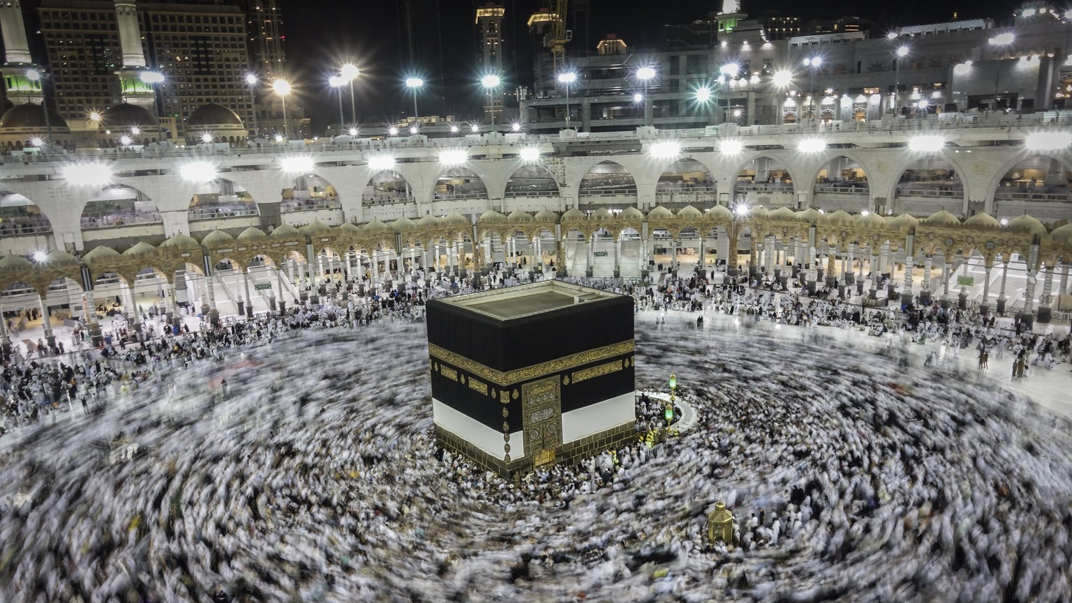 epa06170838 A slow shutter speed picture shows Muslim worshippers praying around the holy Kaaba at the Grand Mosque in Mecca, Saudi Arabia, 29 August 2017. Around 2.6 million muslim are expected to at ...