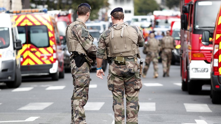 epaselect epa07891618 Military forces establish a security perimeter near Paris police headquarters after a man has been killed after attacking officers with a knife in Paris, France, 03 October 2019. ...