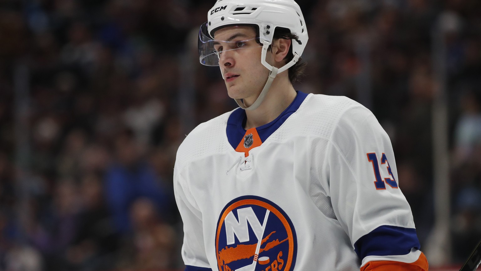 FILE - This Feb. 19, 2020 file photo shows New York Islanders center Mathew Barzal (13) during the second period of an NHL hockey game in Denver. Barzal has agreed to terms on a contract with the New  ...