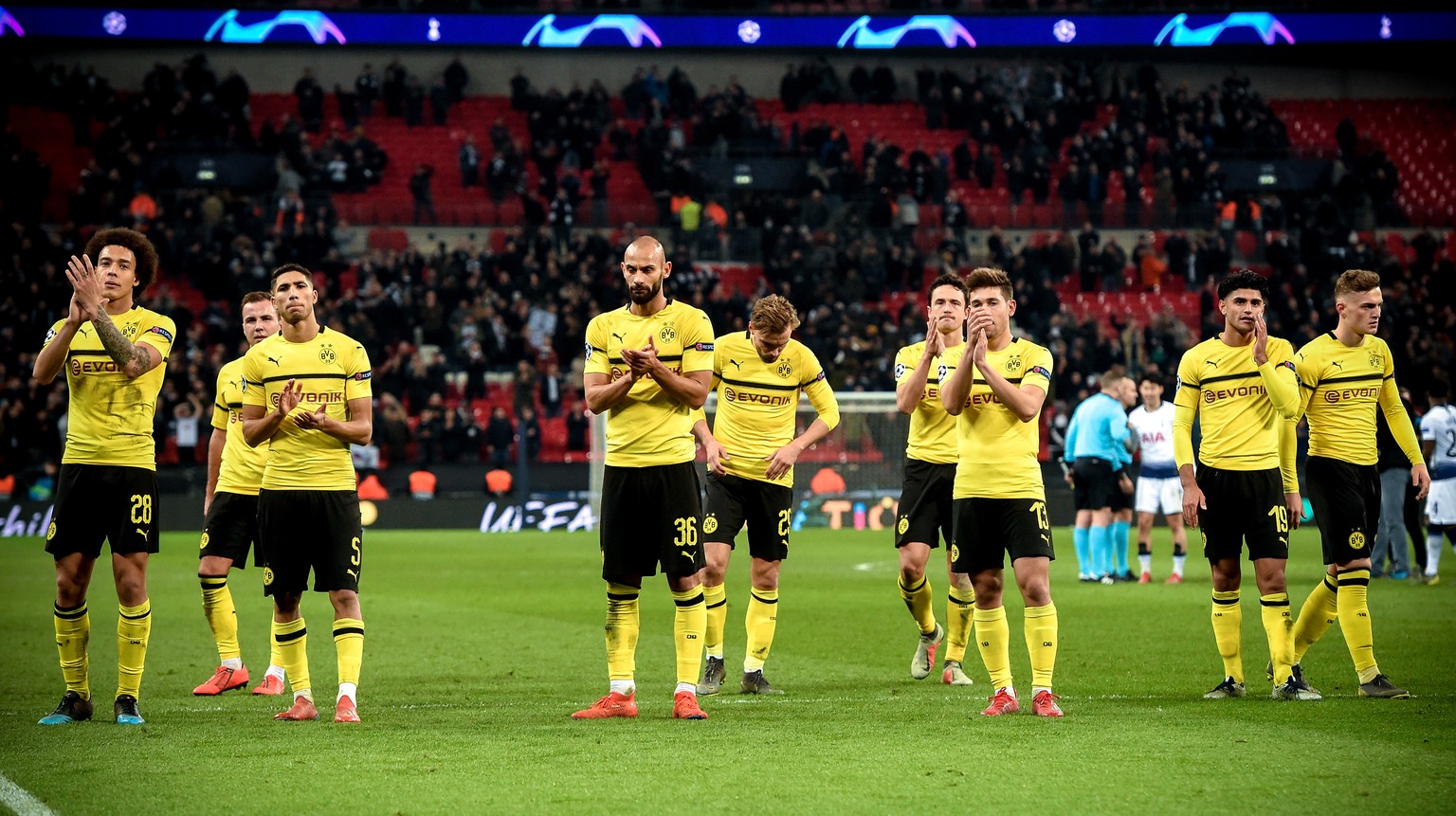 epa07368005 Players of Dortmund react after losing the UEFA Champions League round of 16 soccer match between Tottenham Hotspur and Borussia Dortmund at Wembley Stadium, Britain, 13 February 2019. EPA ...