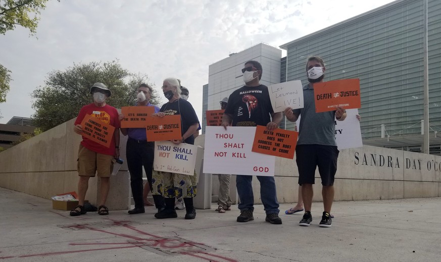 Members of Death Penalty Alternatives for Arizona demonstrate against the scheduled execution of the only Native American on federal death row, Tuesday, Aug. 25, 2020, outside the Sandra Day O&#039;Co ...