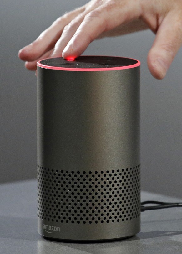 A new Amazon Echo is displayed during a program announcing several new Amazon products by the company, Wednesday, Sept. 27, 2017, in Seattle. Amazon says it is cutting the price of its Echo smart spea ...