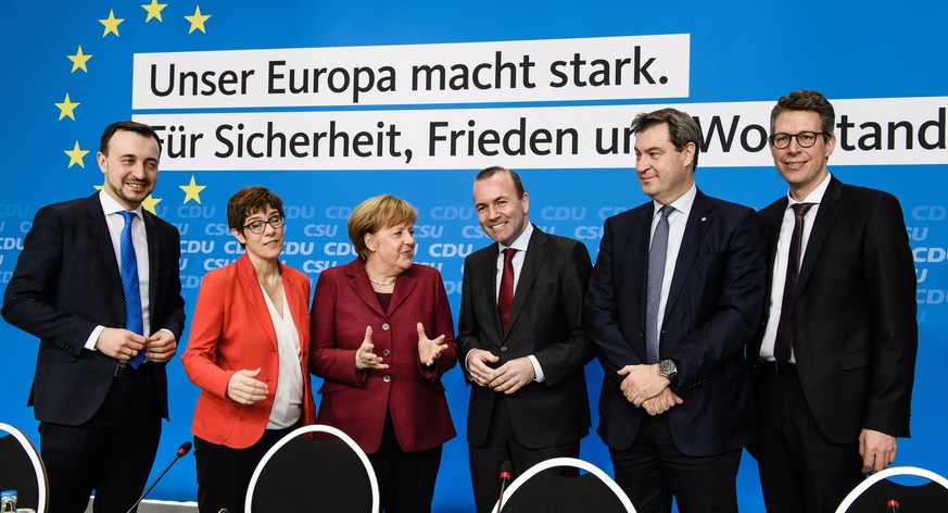 epa07462019 (L-R) Christian Democratic Union (CDU) Secretary General Paul Ziemiak, CDU party chairwoman Annegret Kramp-Karrenbauer, German Chancellor Angela Merkel, European People&#039;s Party (EPP)  ...