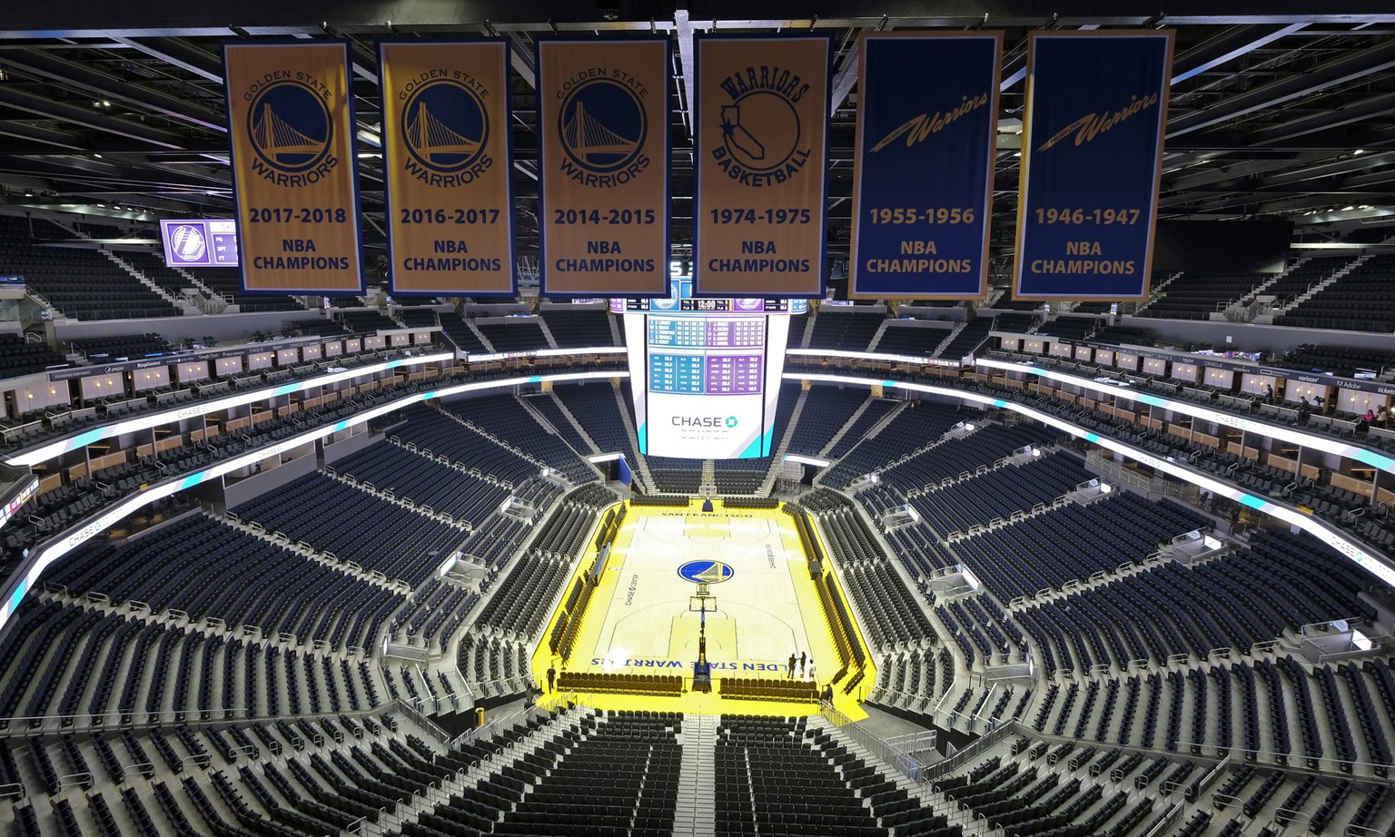 FILE - In this Aug. 26, 2019, file photo, the Golden State Warriors championship banners hang above the seating and basketball court at the Chase Center in San Francisco. Stephen Curry knows how diffe ...