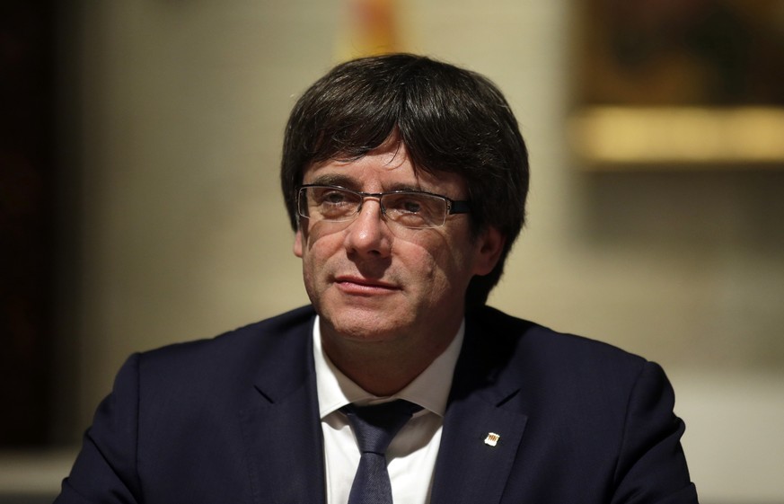 Catalan president Carles Puigdemont looks on during a meeting at the Generalitat Palace in Barcelona, Spain, Friday, Oct. 6, 2017. Catalan president Carles Puigdemont has asked to address the regional ...