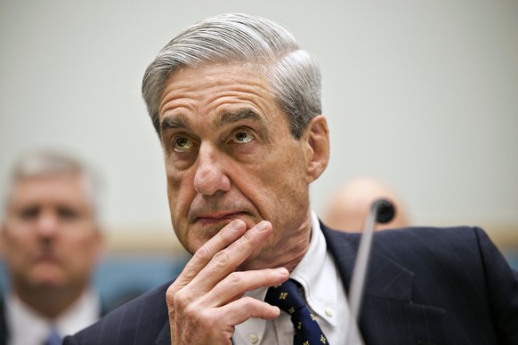 FILE - In this June 13, 2013 file photo, FBI Director Robert Mueller listens as he testifies on Capitol Hill in Washington, as the House Judiciary Committee held an oversight hearing on the FBI. Speci ...