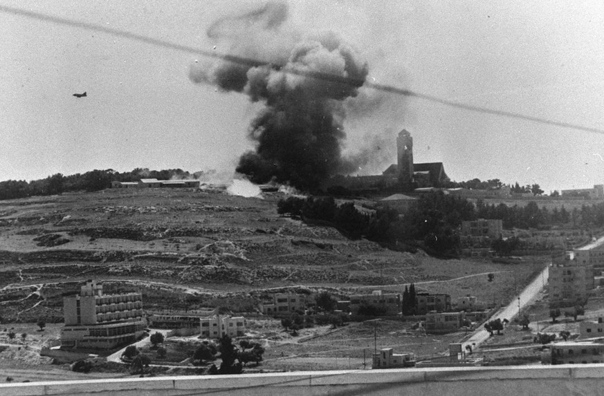 In this photo released by the Government Press Office, Jordanian positions are bombed in the hills around Jerusalem by an Israeli warplane during the Six Day War June, 1967. Four decades after an unde ...