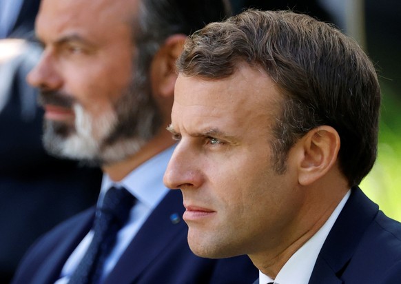 epa08524270 (FILE) - French President Emmanuel Macron (R) and French Prime Minister Edouard Philippe (L) attend a meeting with members of the Citizens&#039; Convention on Climate (CCC) to discuss over ...
