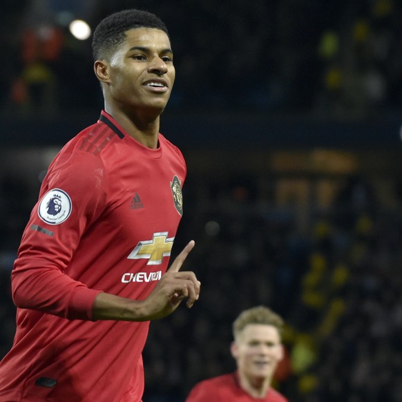 Manchester United&#039;s Marcus Rashford celebrates after scoring his side&#039;s opening goal from the penalty spot during the English Premier League soccer match between Manchester City and Manchest ...