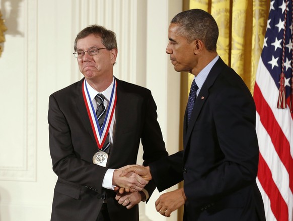 Arthur Levinson shakes hands with U.S. President Barack Obama after being awarded the National Medal of Technology and Innovation at a ceremony in the East Room of the White House in Washington Novemb ...