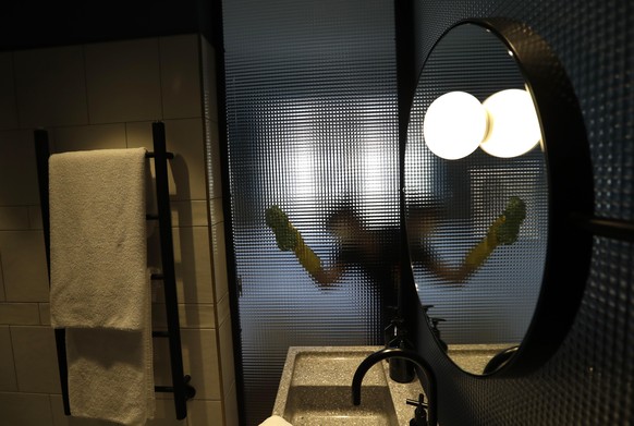 A housekeeper prepares a room for customers at a hotel in Prague, Czech Republic, Monday, May 25, 2020. The bars, restaurants and cafes are returning to full service in the Czech Republic as the gover ...