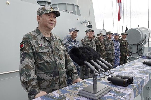 FILE - In this April 12, 2018, file photo released by Xinhua News Agency, Chinese President Xi Jinping speaks after reviewing the Chinese People&#039;s Liberation Army (PLA) Navy fleet in the South Ch ...