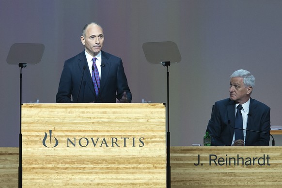 Joseph Jimenez, CEO, left, and Joerg Reinhardt, Chairman of the Board of Directors, right, attend the general assembly of Novartis AG in the St. Jakobshalle in Basel, Switzerland, on Tuesday, February ...