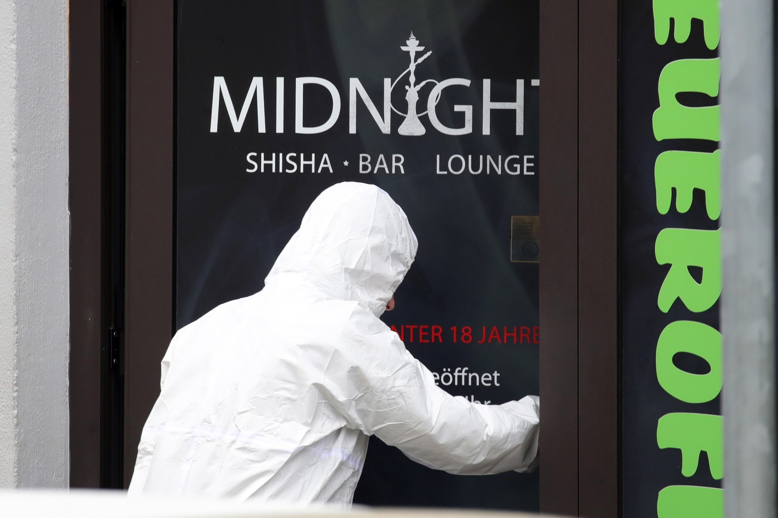 epa08229956 Police investigators enter Midnight shisha bar after two shootings in Hanau, Germany, 20 February 2020. At least nine people were killed in two shootings at shisha bars in Hanau, police sa ...