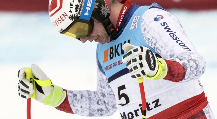 epa05777986 Beat Feuz of Switzerland reacts in the finish area during the men Super-G race at the 2017 FIS Alpine Skiing World Championships in St. Moritz, Switzerland, 08 February 2017. EPA/PETER SCH ...