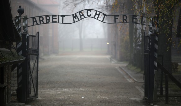OSWIECIM, POLAND - NOVEMBER 15: The infamous German inscription that reads &#039;Work Makes Free&#039; at the main gate of the Auschwitz I extermination camp on November 15, 2014 in Oswiecim, Poland.  ...
