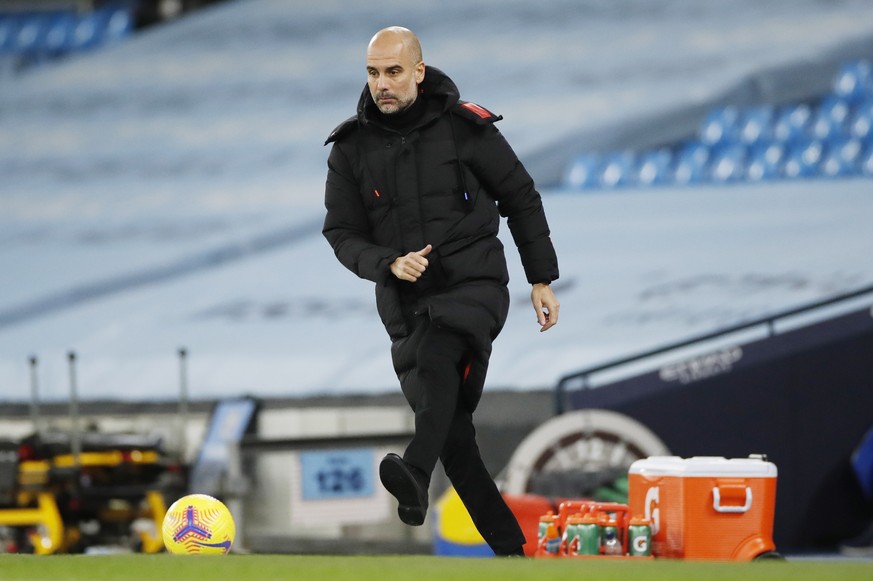 epa08886130 Manchester City&#039;s manager Pep Guardiola kicks the ball during the English Premier League match between Manchester City and West Bromwich Albion FC in Manchester, Britain, 15 December  ...