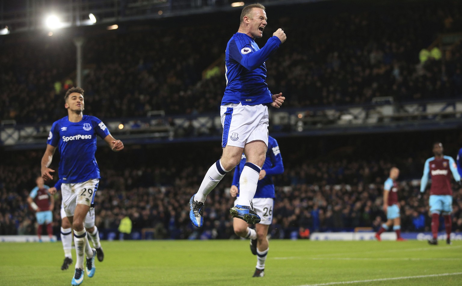 Everton&#039;s Wayne Rooney celebrates scoring his side&#039;s first goal against West Ham United during the English Premier League soccer match at Goodison Park, Liverpool, England, Wednesday Nov. 29 ...