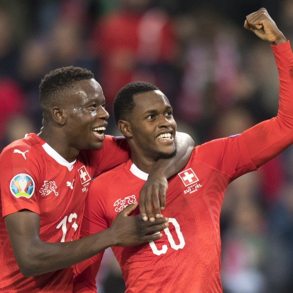 Switzerland&#039;s midfielder Denis Zakaria, left, and Switzerland&#039;s midfielder Edimilson Fernandes, right celebrate the second goal during the UEFA Euro 2020 qualifying Group D soccer match betw ...
