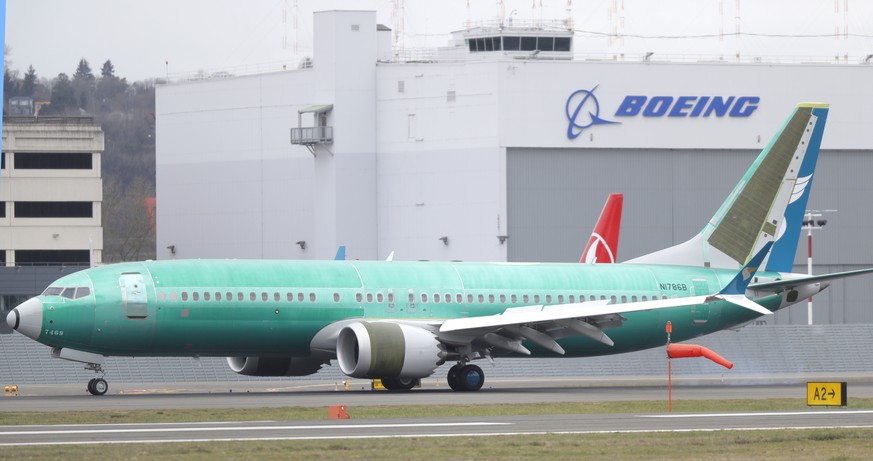 A Boeing 737 MAX 8 being built for Oman Air taxis past a Boeing hanger after landing at Boeing Field, Friday, March 22, 2019, in Seattle. In a blow for Boeing, Indonesia&#039;s flag carrier is seeking ...
