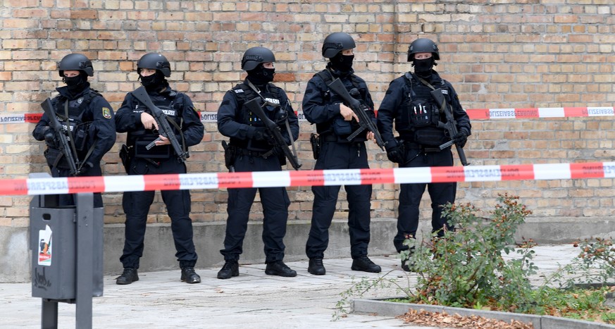 epa07907546 Police guard a crime scene near a Synagogue after a shooting in Halle, Germany, 09 October 2019. According to the police two people were killed in shootings in front of a Synagogue and a K ...