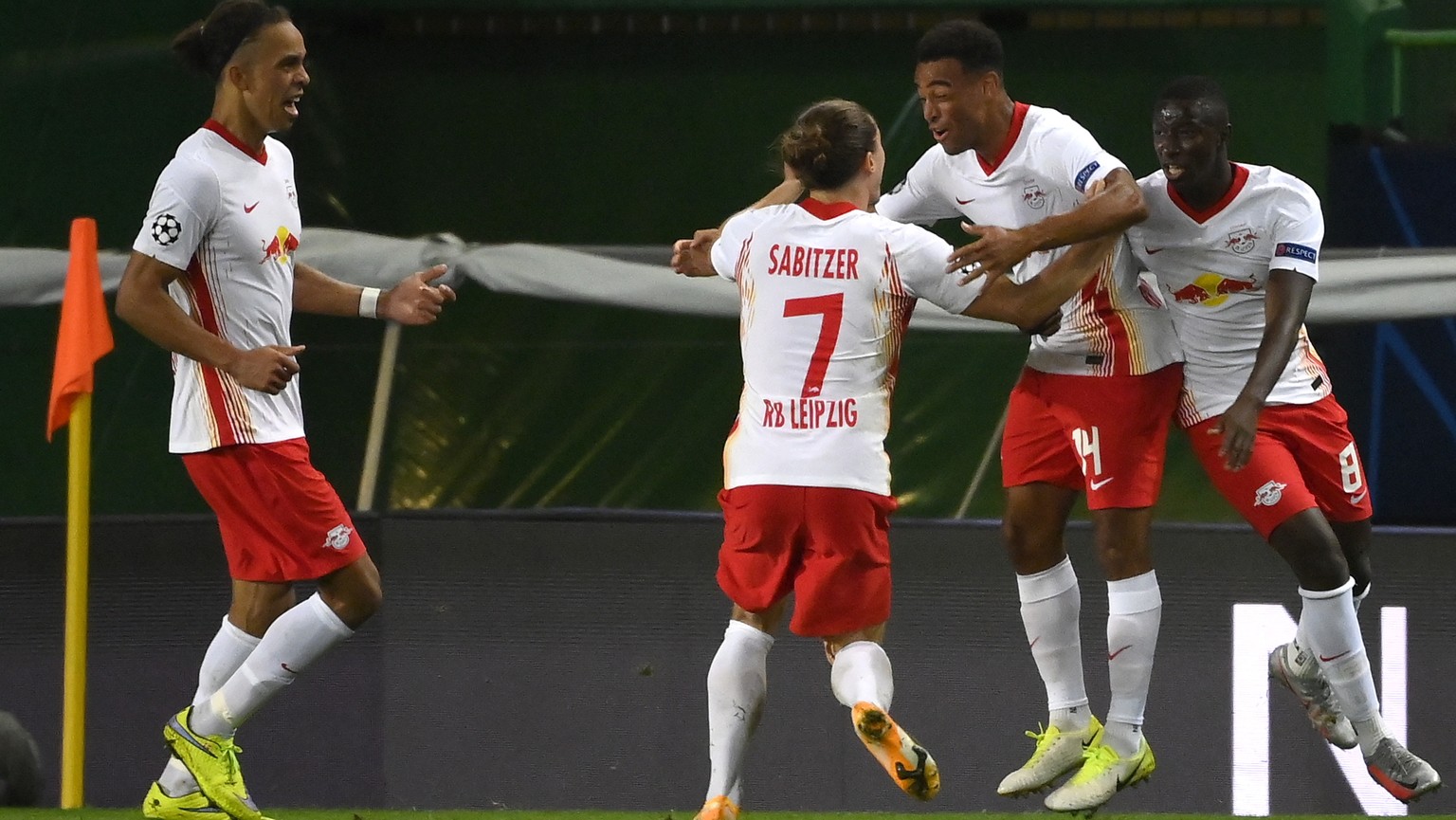epa08601962 Tyler Adams (2-R) of Leipzig celebrates scoring the 2-1 lead during the UEFA Champions League quarter final match between RB Leipzig and Atletico Madrid in Lisbon, Portugal, 13 August 2020 ...
