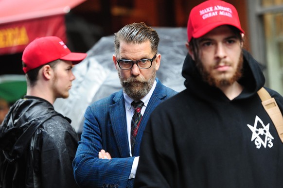 CENTER Gavin McInnes attends rally - Alt-right protestors hold rally in front of CUNY on East 42nd St. and 3rd ave to protest against CUNY&#039;s choice of Muslim-American activist Linda Sarsour as co ...