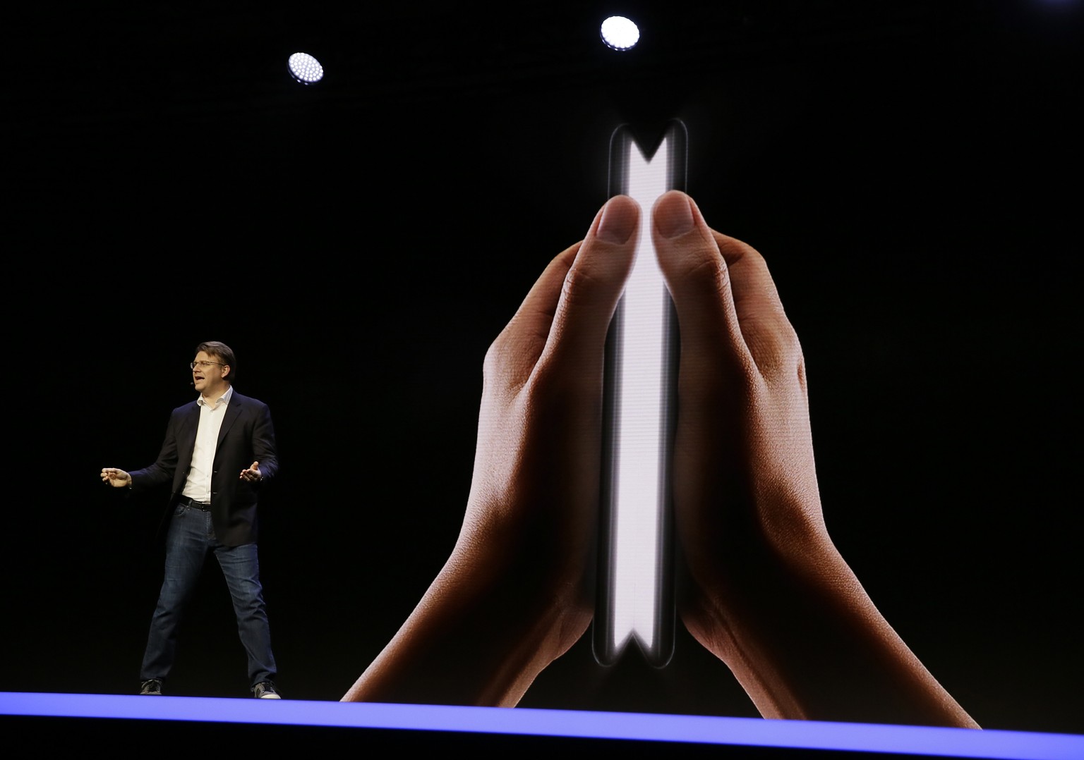 Justin Denison, SVP of Mobile Product Development, speaks about the Infinity Flex Display of a folding smartphone during the keynote address of the Samsung Developer Conference, Wednesday, Nov. 7, 201 ...