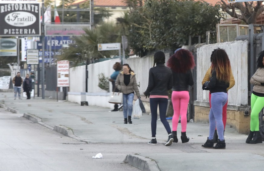 Nigerian prostitutes wait for clients in Castel Volturno, near Naples, Italy, Tuesday, Feb. 13, 2018. Nigerian teenagers and young women selling sex is a common sight for motorists in Italy. Working a ...