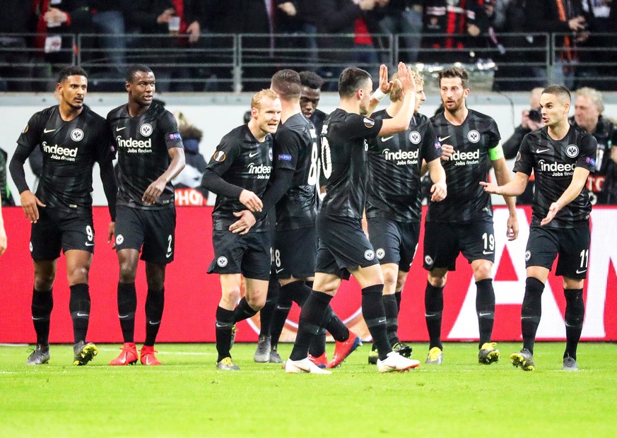 epa07385970 Frankfurt&#039;s Sebastien Haller (L) celebrates with his teammates after scoring the 2-0 lead from the penalty spot during the UEFA Europa League round of 32, second leg soccer match betw ...