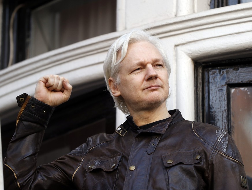 Julian Assange greets supporters outside the Ecuadorian embassy in London, Friday May 19, 2017. Sweden&#039;s top prosecutor says she is dropping an investigation into a rape claim against WikiLeaks f ...