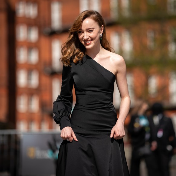 epa09129706 A handout photo made available by the BAFTA shows Phoebe Dynevor arriving at the 74th annual British Academy Film Award at the Royal Albert Hall in London, Britain, 11 April 2021. The cere ...