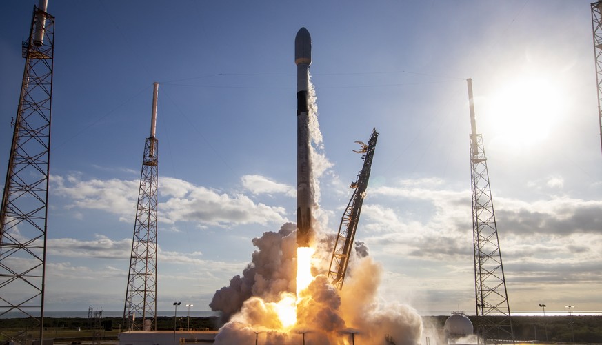 epa08177545 A handout photo made available by SpaceX shows the Falcon 9 rocket lifting off with a cargo of 60 Starlink satellites, from the space Launch Complex 40 at the Cape Canaveral Air Force Stat ...