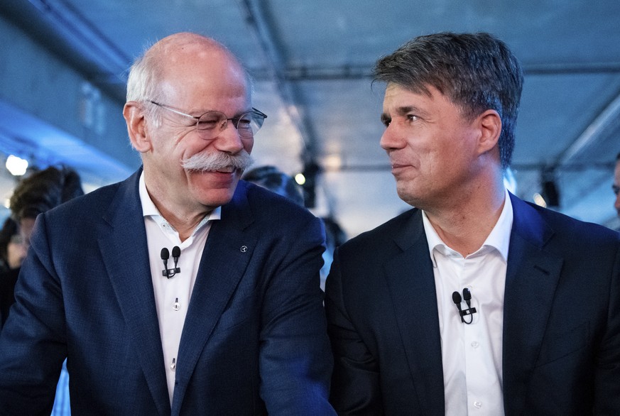 BMW CEO Harald Krueger, right, and Mercedes-Benz CEO Dieter Zetsche of Daimler, left, sit together at a press conference in Berlin, Germany, Friday, Feb. 22, 2019. Automakers Daimler and BMW are forma ...