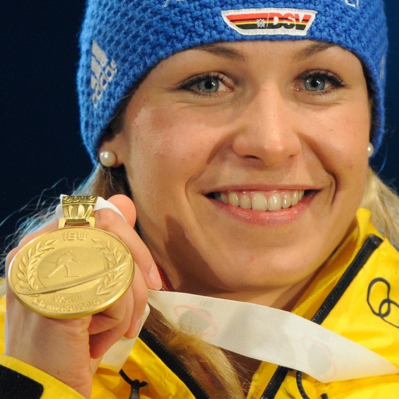 Winner Magdalena Neuner of Germany poses with her gold medal during the victory ceremony for the 7.5 km Sprint competition at the Biathlon World Championships in Ruhpolding, Germany, Saturday, March 3 ...