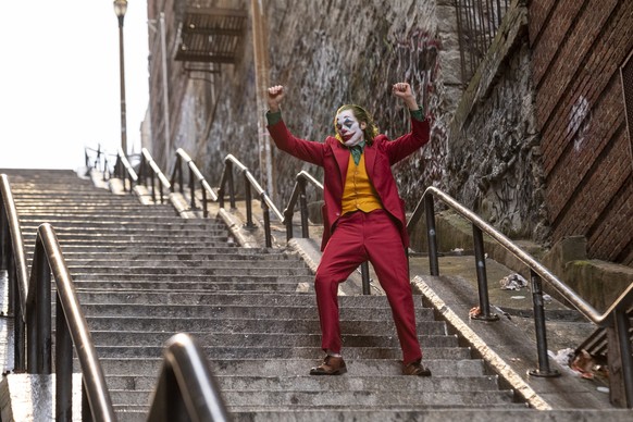 This image released by Warner Bros. Pictures shows Joaquin Phoenix in a scene from &quot;Joker.&quot; A set of outdoor steps in the Bronx has become a tourist attraction in recent weeks since the rele ...